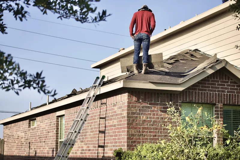Professional roofer working on a residential roof in Lake Arrowhead